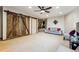 Spacious living room with a sliding barn door, neutral color palette, and ample space for relaxing and entertaining at 2122 Cramner Ct, Evergreen, CO 80439
