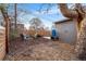 Backyard space features modern wooden fencing, fire pit and chairs, great for entertainment and outdoor living at 1623 Dayton St, Aurora, CO 80010