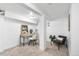 Finished basement area featuring neutral carpeting, exposed beams, and a small workspace at 1623 Dayton St, Aurora, CO 80010