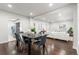 Open-concept living and dining area with hardwood floors and contemporary decor at 1623 Dayton St, Aurora, CO 80010