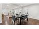 Open-concept living and dining area with hardwood floors and contemporary decor at 1623 Dayton St, Aurora, CO 80010