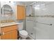 Updated bathroom featuring a vanity with granite countertops and a glass enclosed shower at 7162 Quay St, Arvada, CO 80003