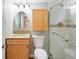Updated bathroom featuring a vanity with granite countertops and a glass enclosed shower at 7162 Quay St, Arvada, CO 80003