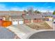Classic brick ranch home with a well-maintained lawn and attached garage at 7162 Quay St, Arvada, CO 80003