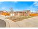 Charming brick ranch with a two-car garage on a corner lot at 7162 Quay St, Arvada, CO 80003