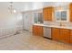 Kitchen with stainless steel appliances, light countertops and tile flooring at 7162 Quay St, Arvada, CO 80003