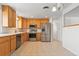 Well-lit kitchen with stainless steel appliances and bright cabinets at 7162 Quay St, Arvada, CO 80003