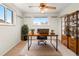 Home office with natural light, modern desk, and bookcase, creating a productive workspace at 7162 Quay St, Arvada, CO 80003