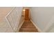 Carpeted staircase with white metal railing leading to lower level at 7162 Quay St, Arvada, CO 80003