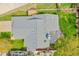 Roof top aerial view of a well maintained house with backyard deck, and mature landscaping at 4734 S Garland St, Littleton, CO 80123