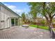 Back deck with a hot tub, a fenced lawn and a glass sliding door into the home at 4734 S Garland St, Littleton, CO 80123