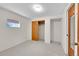 Simple bedroom with neutral paint, carpeted floors, closet with sliding doors, and natural light at 4734 S Garland St, Littleton, CO 80123