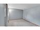 Bedroom featuring carpeting, light gray walls, and a floor lamp at 4734 S Garland St, Littleton, CO 80123