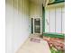 A well-maintained front entrance showing the house number and a charming green-framed door at 4734 S Garland St, Littleton, CO 80123