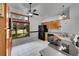 Kitchen with classic wood cabinets, tiled floors, and a large window providing natural light at 4734 S Garland St, Littleton, CO 80123