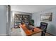 Home office featuring a large desk, comfortable chair, and organized shelving at 4734 S Garland St, Littleton, CO 80123