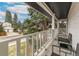 Charming balcony with seating, perfect for enjoying serene views of the neighborhood at 6660 E Floyd Ave, Denver, CO 80224