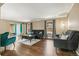 Bright and airy living room with hardwood floors, neutral decor, and ample seating at 6660 E Floyd Ave, Denver, CO 80224