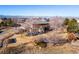 Aerial view of house, showcasing backyard and mountain views at 15050 Harrison St, Brighton, CO 80602