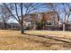 Large backyard with two-story home and deck at 15050 Harrison St, Brighton, CO 80602
