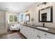 Elegant bathroom with double vanity, soaking tub, and walk-in shower at 15050 Harrison St, Brighton, CO 80602