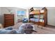 ' bedroom with bunk beds, ample storage, and a window seat at 15050 Harrison St, Brighton, CO 80602