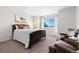 Spacious bedroom with large window and plush seating at 15050 Harrison St, Brighton, CO 80602