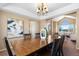 Spacious dining area with hardwood floors and views into the living room at 15050 Harrison St, Brighton, CO 80602