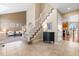 Bright and spacious entryway with tiled floors and staircase at 15050 Harrison St, Brighton, CO 80602