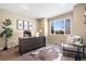 Home office with large window, desk, and comfortable seating at 15050 Harrison St, Brighton, CO 80602