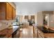 Open concept kitchen with granite countertops and breakfast bar at 15050 Harrison St, Brighton, CO 80602