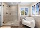 Large walk-in shower with glass enclosure and built-in seat at 15050 Harrison St, Brighton, CO 80602