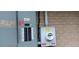 Close up of electrical panel and photovoltaic system with safety stickers on a brick wall at 2008 Moline St, Aurora, CO 80010