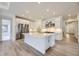 Modern kitchen with stainless steel appliances, a spacious island, and ample cabinet space at 15616 W Beloit Ave, Morrison, CO 80465