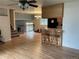 Hardwood floor dining room with kitchen island and view to staircase at 13478 W Grand Dr, Morrison, CO 80465