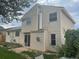 Rear view of a house showcasing a sliding glass door leading to a patio at 13478 W Grand Dr, Morrison, CO 80465