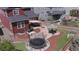 An aerial view of the backyard shows a trampoline, a large patio, artificial grass and outdoor dining and BBQ area at 4840 Point Mesa St, Castle Rock, CO 80108