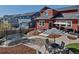 Backyard featuring a trampoline, patio with furniture, string lights, and well-maintained landscaping at 4840 Point Mesa St, Castle Rock, CO 80108
