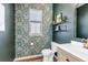 Stylish powder room featuring elegant wallpaper, floating shelves, and modern fixtures at 4840 Point Mesa St, Castle Rock, CO 80108