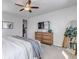 A large bedroom offers a comfortable sleeping space and a stylish dresser with plenty of storage at 4840 Point Mesa St, Castle Rock, CO 80108