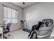 Versatile bedroom with massage chair, treadmill and natural light from a large window at 4840 Point Mesa St, Castle Rock, CO 80108