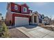 A two-story home features a two car garage, covered porch, and inviting curb appeal at 4840 Point Mesa St, Castle Rock, CO 80108