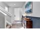 Inviting foyer with wood floors, a staircase, and a console table with decor at 4840 Point Mesa St, Castle Rock, CO 80108
