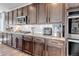 Gourmet kitchen features stainless steel appliances, granite countertops, and ample cabinet space at 4840 Point Mesa St, Castle Rock, CO 80108