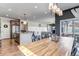 Open kitchen and dining area featuring granite countertops, stainless steel appliances and a large island with a breakfast bar at 4840 Point Mesa St, Castle Rock, CO 80108