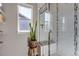 Bright shower featuring white subway tile, a built-in bench and modern fixtures at 4840 Point Mesa St, Castle Rock, CO 80108