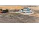 Wide aerial showcasing the home and its placement within a large, open parcel of land at 52900 E 88Th Ave, Strasburg, CO 80136