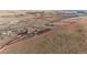 Aerial view of the entire property with a red outline showing lot boundaries at 52900 E 88Th Ave, Strasburg, CO 80136