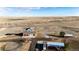 Aerial view of the property with metal buildings, horse arena, and other outbuildings at 52900 E 88Th Ave, Strasburg, CO 80136