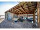 An open-air metal barn with exposed wood beams for structural support at 52900 E 88Th Ave, Strasburg, CO 80136